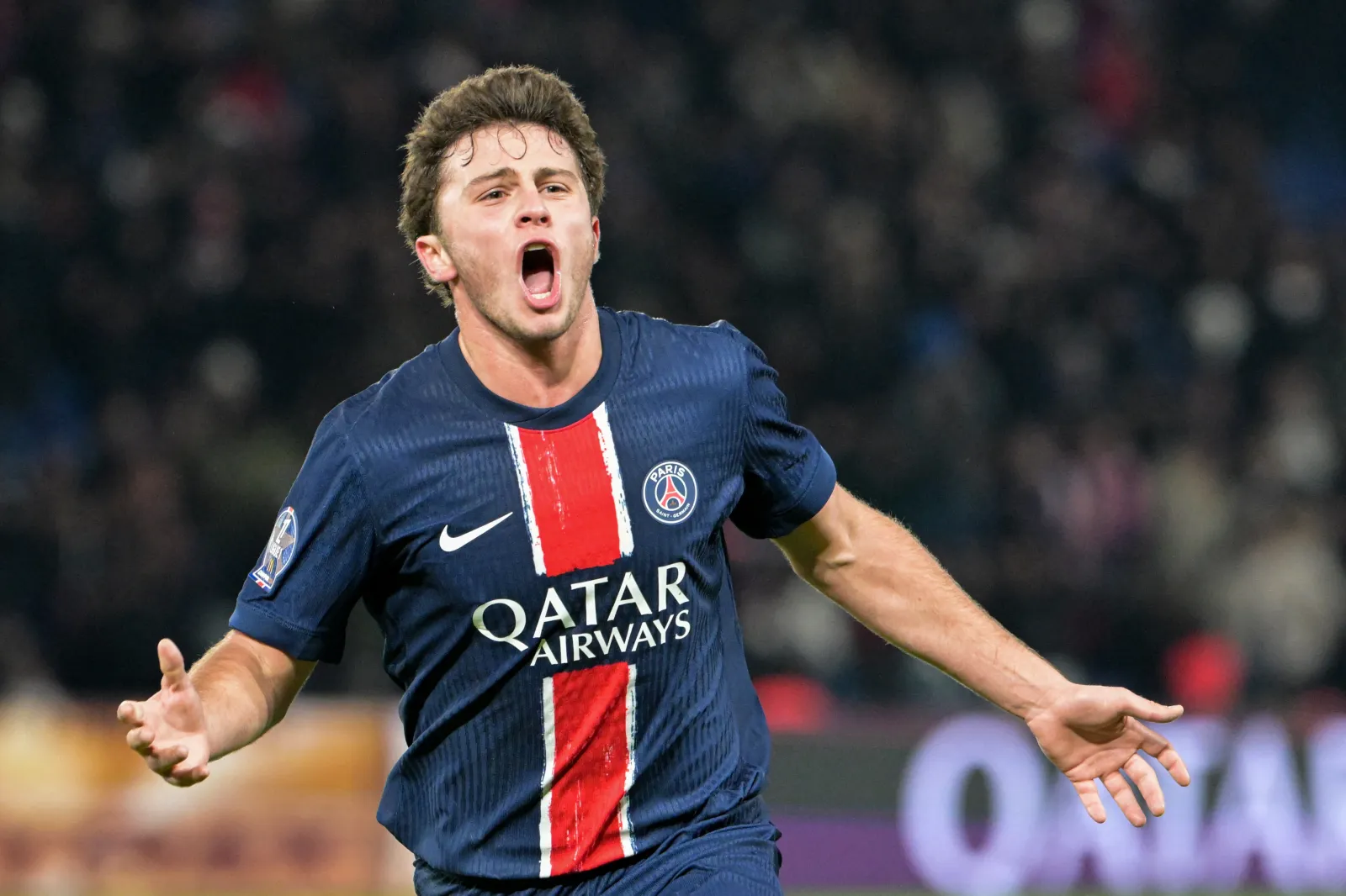TOPSHOT - Paris Saint-Germain's Portuguese midfielder #87 Joao Neves celebrates after scoring his team's first goal during the French L1 football match between Paris Saint-Germain (PSG) and Toulouse at the Parc des Princes Stadium in Paris, on November 22, 2024. (Photo by Bertrand GUAY / AFP via Getty Images)