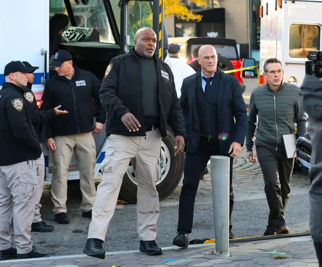 Christopher Meloni, second from the right, filming on the set of
