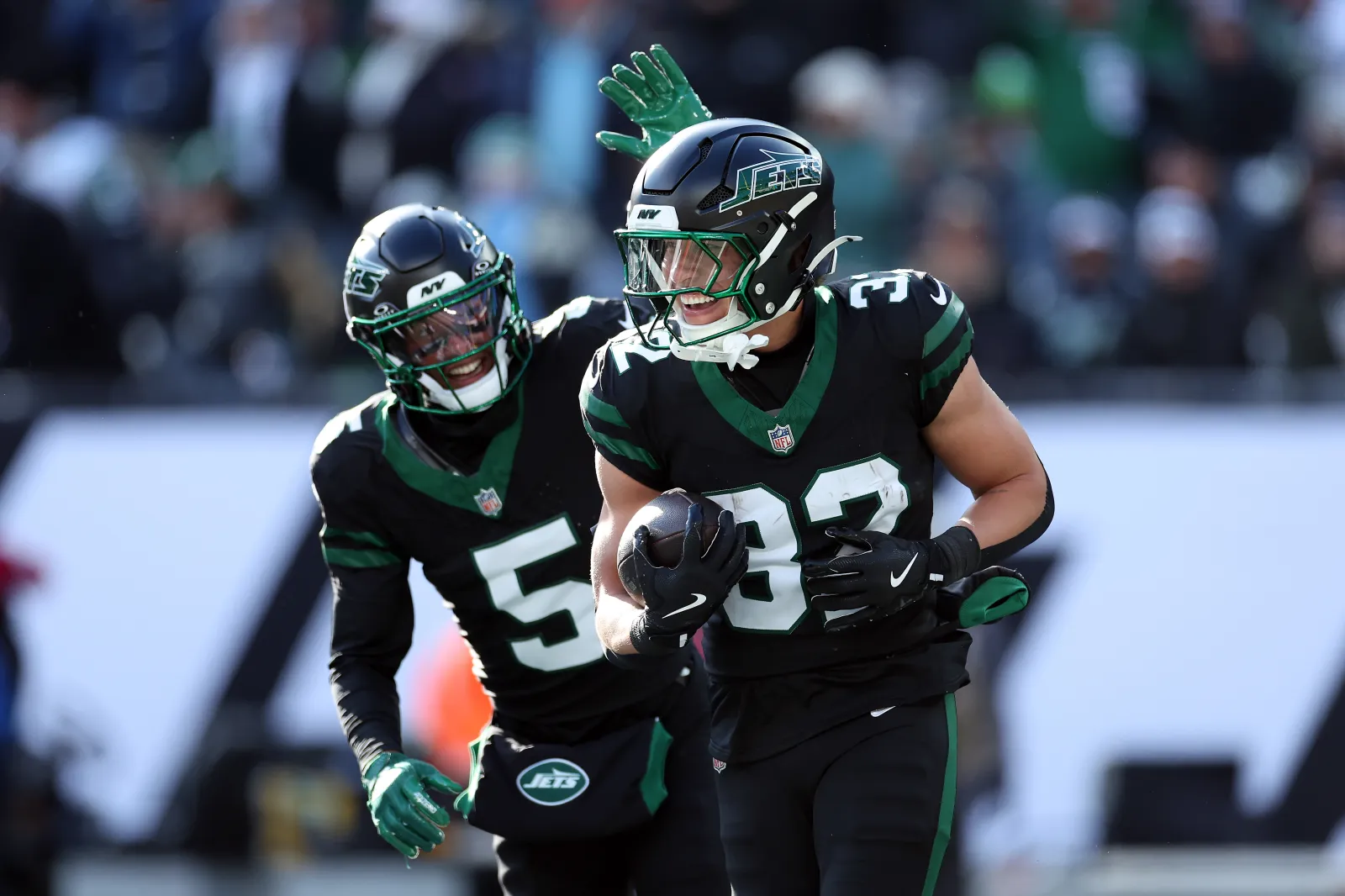 Isaiah Davis #32 and Garrett Wilson #5 of the New York Jets celebrate after scoring a touchdown in the first quarter of a game against the Seattle Seahawks at MetLife Stadium on December 01, 2024 in East Rutherford, New Jersey. (Photo by Luke Hales/Getty Images)
