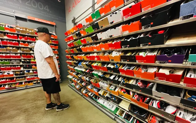 A man shops for shoes at a Nike outlet store in Los Angeles on April 10, 2025.