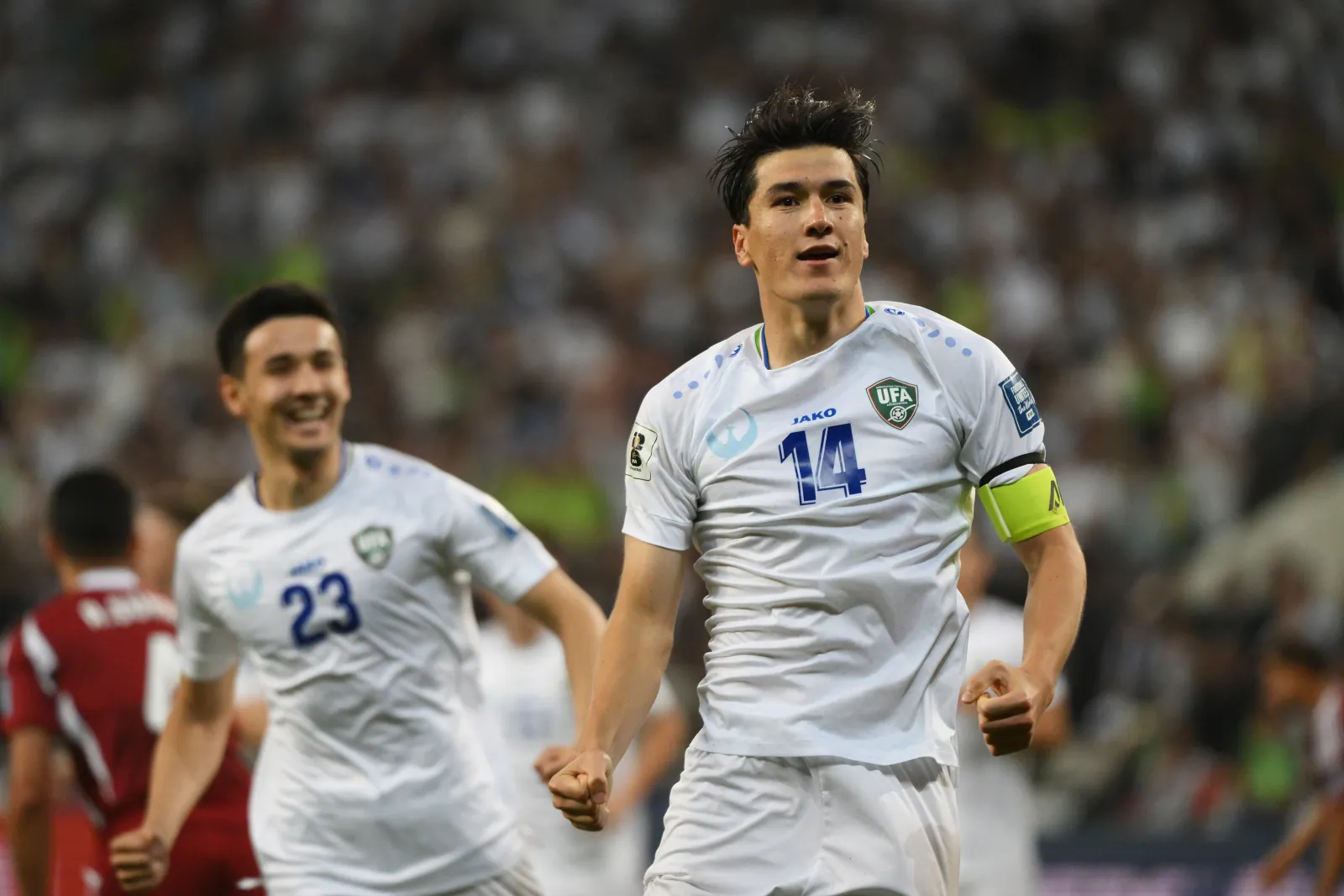 TASHKENT, UZBEKISTAN - JUNE 10: Eldor Shomurodov of Uzbekistan celebrates scoring his team's second goal during the FIFA World Cup Qualifier match between Uzbekistan and Qatar at Milliy Stadioni on June 10, 2025 in Tashkent, Uzbekistan. (Photo by Anvar Ilyasov/Getty Images)