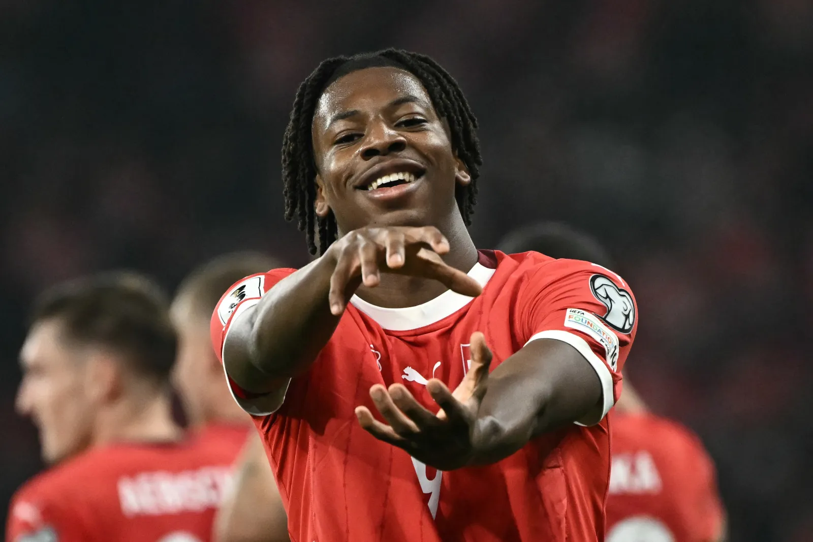 TOPSHOT - Switzerland's midfielder #09 Johan Manzambi celebrates after scoring his team's fourth goal during the FIFA World Cup 2026 Group B European qualification football match between Switzerland and Sweden at the Geneva stadium, in Geneva, on November 15, 2025. (Photo by Fabrice COFFRINI / AFP via Getty Images)