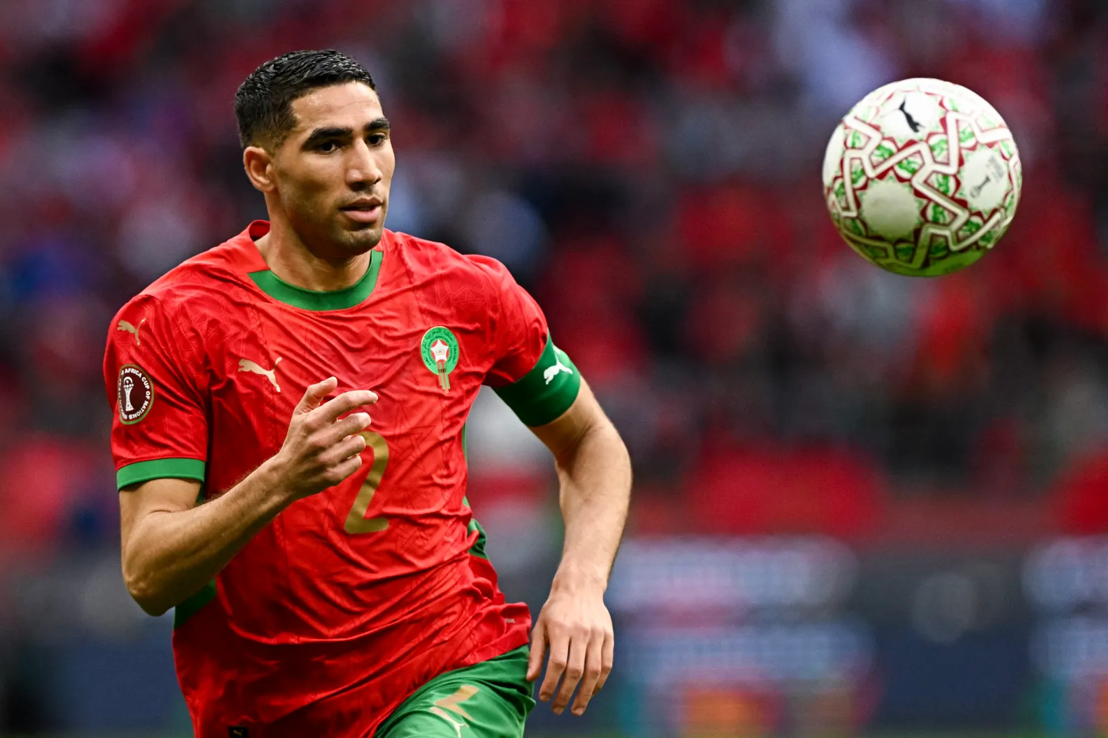 TOPSHOT - Morocco's defender #02 Achraf Hakimi controls the ball during the Africa Cup of Nations (CAN) round of 16 football match between Morocco and Tanzania at Prince Moulay Abdallah Stadium in Rabat on January 4, 2026. (Photo by Gabriel BOUYS / AFP via Getty Images)