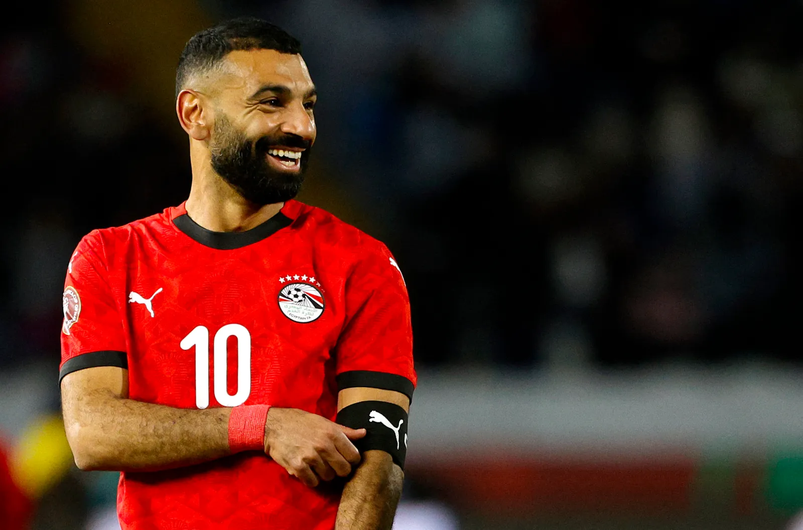 Egypt's forward #10 Mohamed Salah removes the captain's armband during the Africa Cup of Nations (CAN) third place football match between Egypt and Nigeria at the Mohammed V Stadium in Casablanca on January 17, 2026. (Photo by Abdel Majid BZIOUAT / AFP via Getty Images)