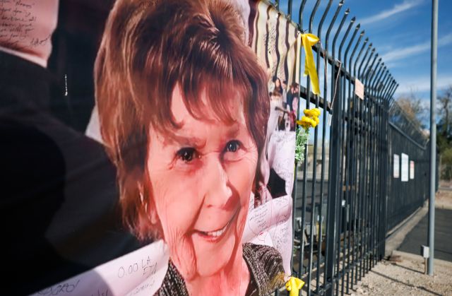 A photograph of Nancy Guthrie is displayed on a banner in front of the KVOA television station on March 1, 2026 in Tucson, Arizona.