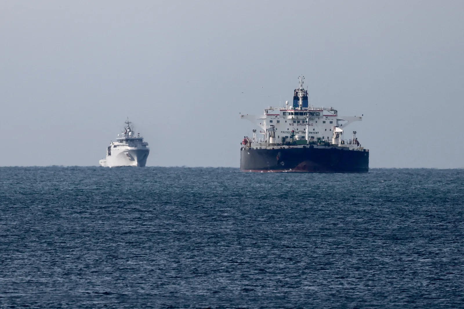 This illustrative image from March 20, 2026 shows a Mozambique-flagged oil tanker "Deyna", suspected of belonging to the Russian's shadow fleet, near the port of Marseille-Fos under surveillance from the French Navy. Photo by Thibaud MORITZ / AFP via Getty Images.