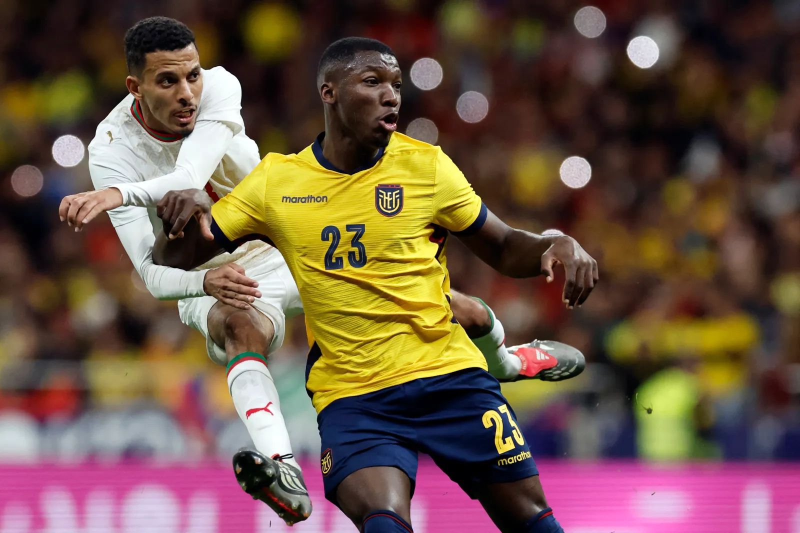 TOPSHOT - Morocco's midfielder #08 Azzedine Ounahi shoots as he is challenged by Ecuador's midfielder #23 Moises Caicedo during the international friendly football match between Morocco and Ecuador at Metropolitano Stadium in Madrid on March 27, 2026. (Photo by Oscar DEL POZO / AFP via Getty Images)