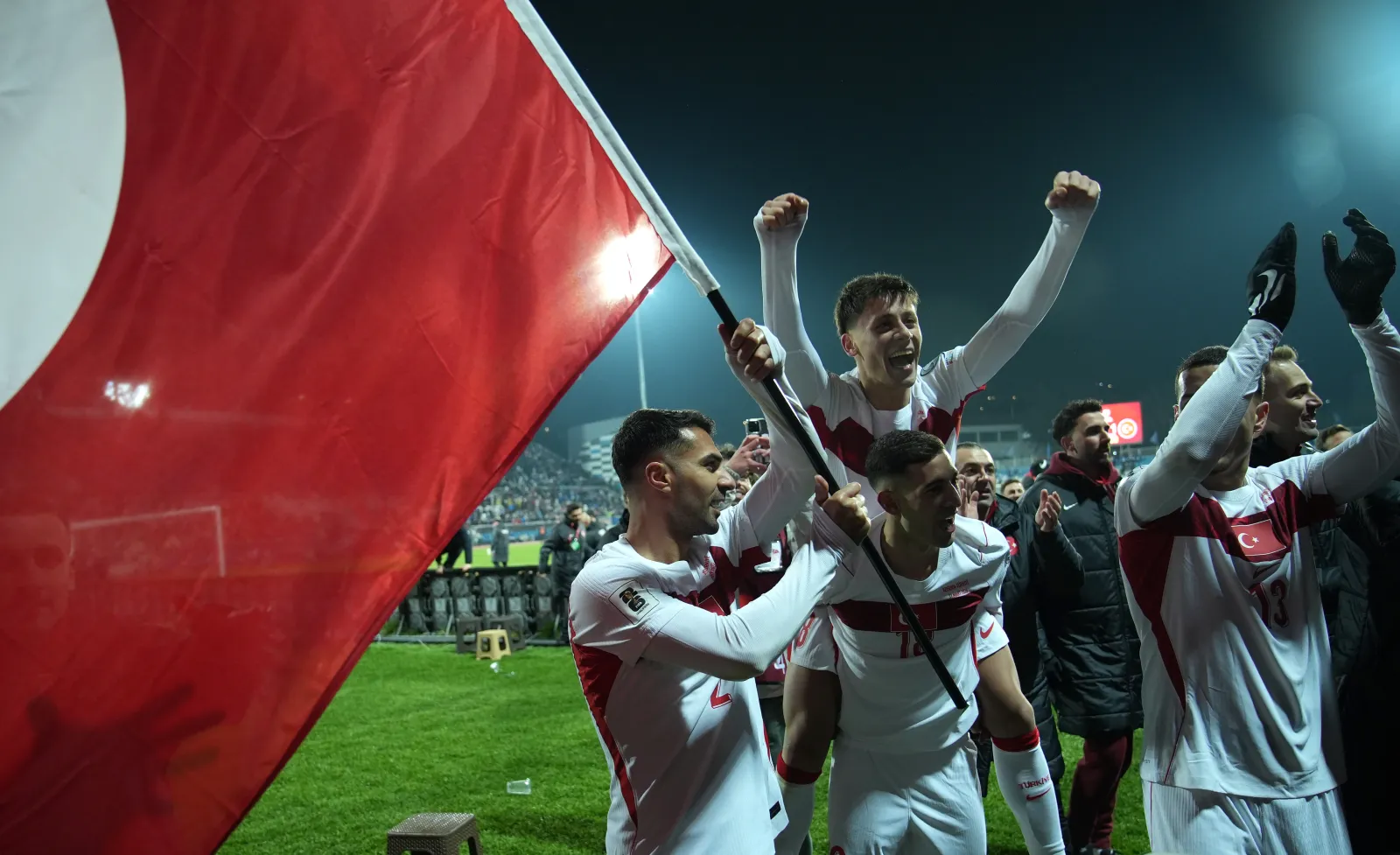 PRISTINA, KOSOVO - MARCH 31: Zeki Celik, Arda Gueler and Mert Muelduer of Turkiye celebrate victory and qualification for the FIFA World Cup 2026 after the FIFA World Cup 2026 European Qualifiers KO play-offs match between Kosovo and Türkiye at Fadil Vokkri Stadium on March 31, 2026 in Pristina, Kosovo. (Photo by Ferdi Limani/Getty Images)