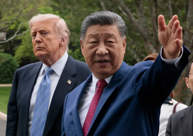 U.S. President Donald Trump, left, and Chinese President Xi Jinping tour Zhongnanhai Garden on May 15, 2026, in Beijing, China.