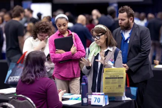 Job seekers attend a small business summit and job fair on May 12, 2026 in Chicago, Illinois.