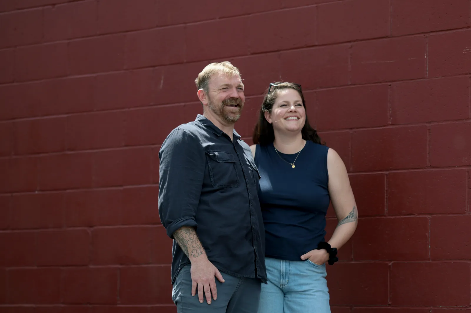 U.S. Senate candidate Graham Platner, left, and his wife Amy Gertner share a moment after an event at the Veterans of Foreign Wars Post 6859 on May 17 in Portland, Maine. (Photo by Joe Raedle/Getty Images)