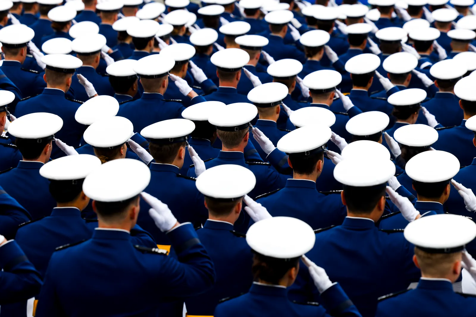 U.S. Air Force Academy cadets salute during their graduation ceremony on May 28 in Colorado Springs, Colorado.