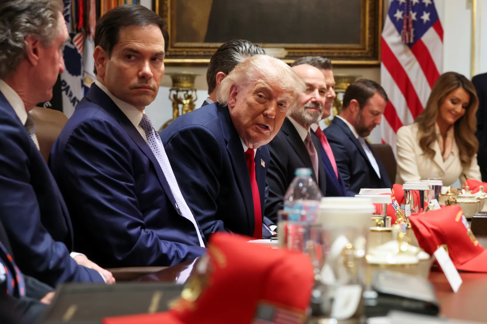 U.S. President Donald Trump, center, speaks as, from left, Interior Secretary Doug Burgum, Secretary of State Marco Rubio, Secretary of War Pete Hegseth, Commerce Secretary Howard Lutnick, Transportation Secretary Sean Duffy, Homeland Security Secretary Markwayne Mullin and Small Business Administration Kelly Loeffler listen during a Cabinet meeting in the Cabinet Room of the White House on May 27, 2026, in Washington. (Photo by Win McNamee/Getty Images)