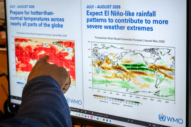 Head of climate prediction services at the World Meteorological Organization (WMO) Wilfran Moufouma-Okia points on graphs displayed on a computer screen at the WMO headquarters in Geneva, on June 1, 2026.