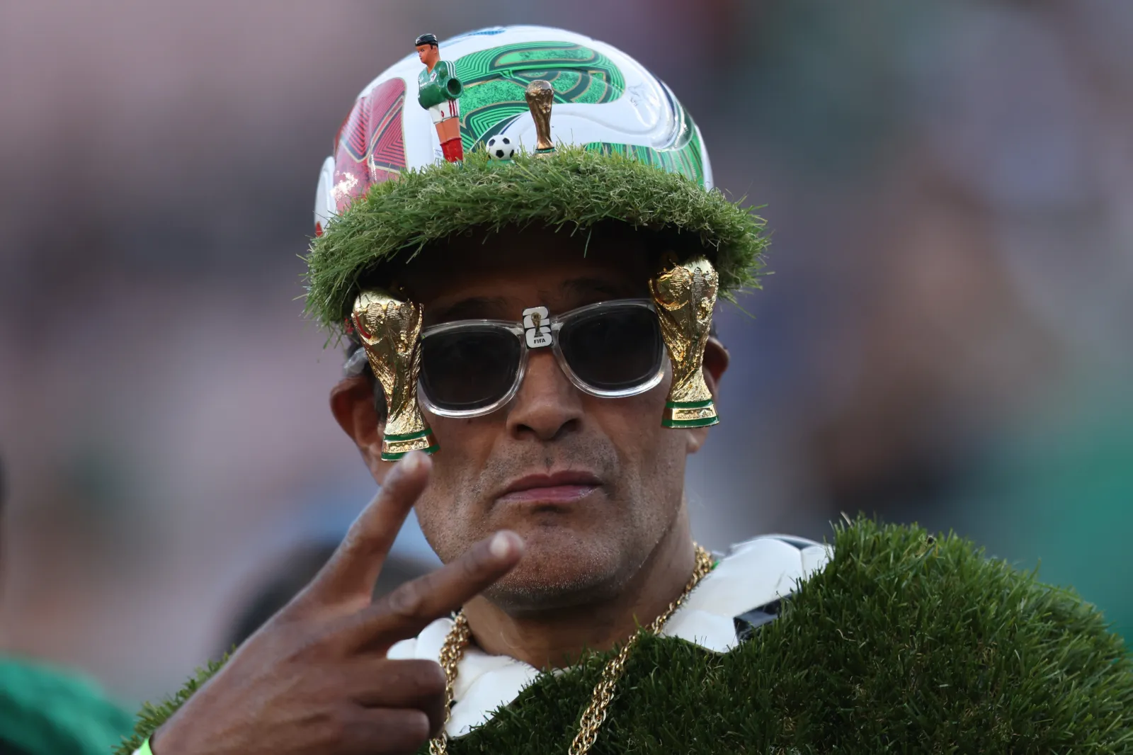 PASADENA, CALIFORNIA - MAY 30: A fan of Mexico wears sunglasses with small replicas of the World Cup trophy prior to the international friendly match between Mexico and Australia at Rose Bowl Stadium on May 30, 2026 in Pasadena, California. (Photo by Luiza Moraes/Getty Images)