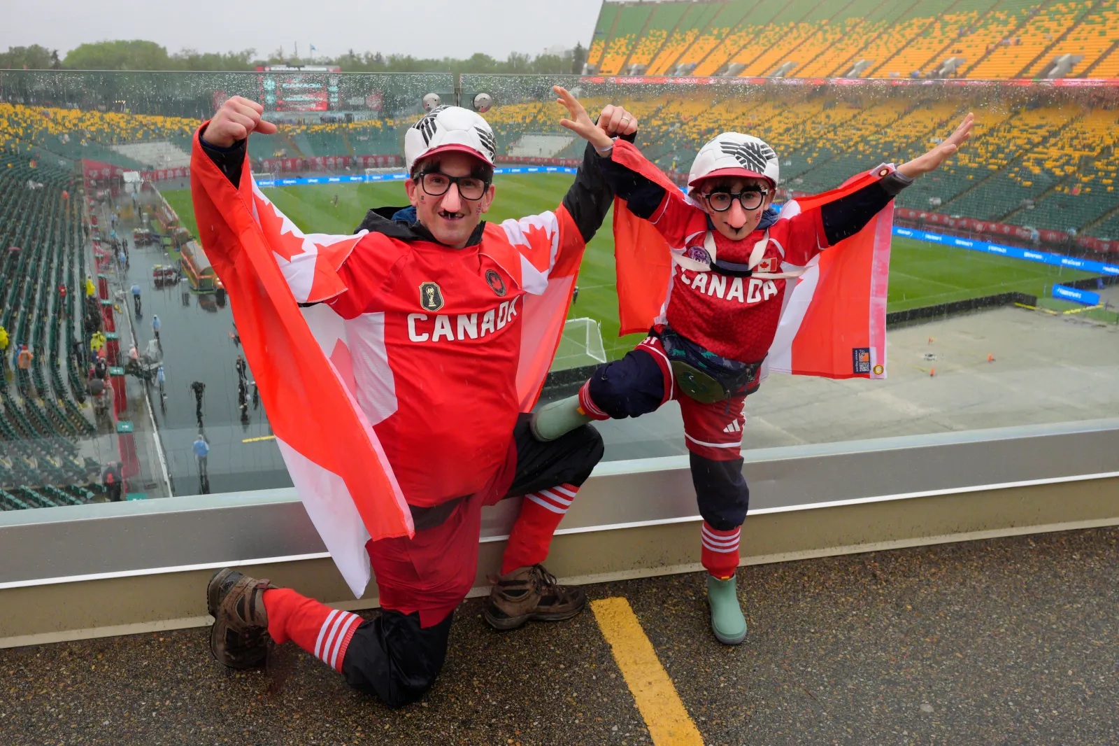 EDMONTON, ALBERTA - JUNE 01: Fans of Canada pose for a photo prior to the international friendly match between Canada and Uzbekistan at Commonwealth Stadium on June 01, 2026 in Edmonton, Alberta. (Photo by Jeff Vinnick/Getty Images)