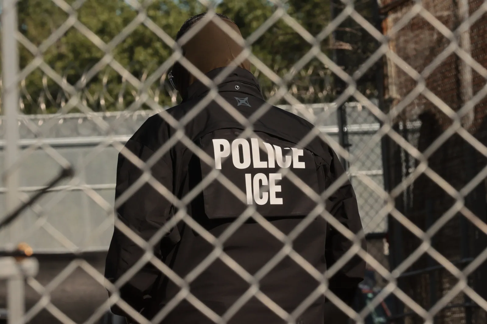 An Immigration and Customs Enforcement agent stands guard ahead of Newark Mayor Ras Baraka's press conference in front of Delaney Hall on June 2, 2026, in Newark, New Jersey. (Michael M. Santiago/Getty Images)