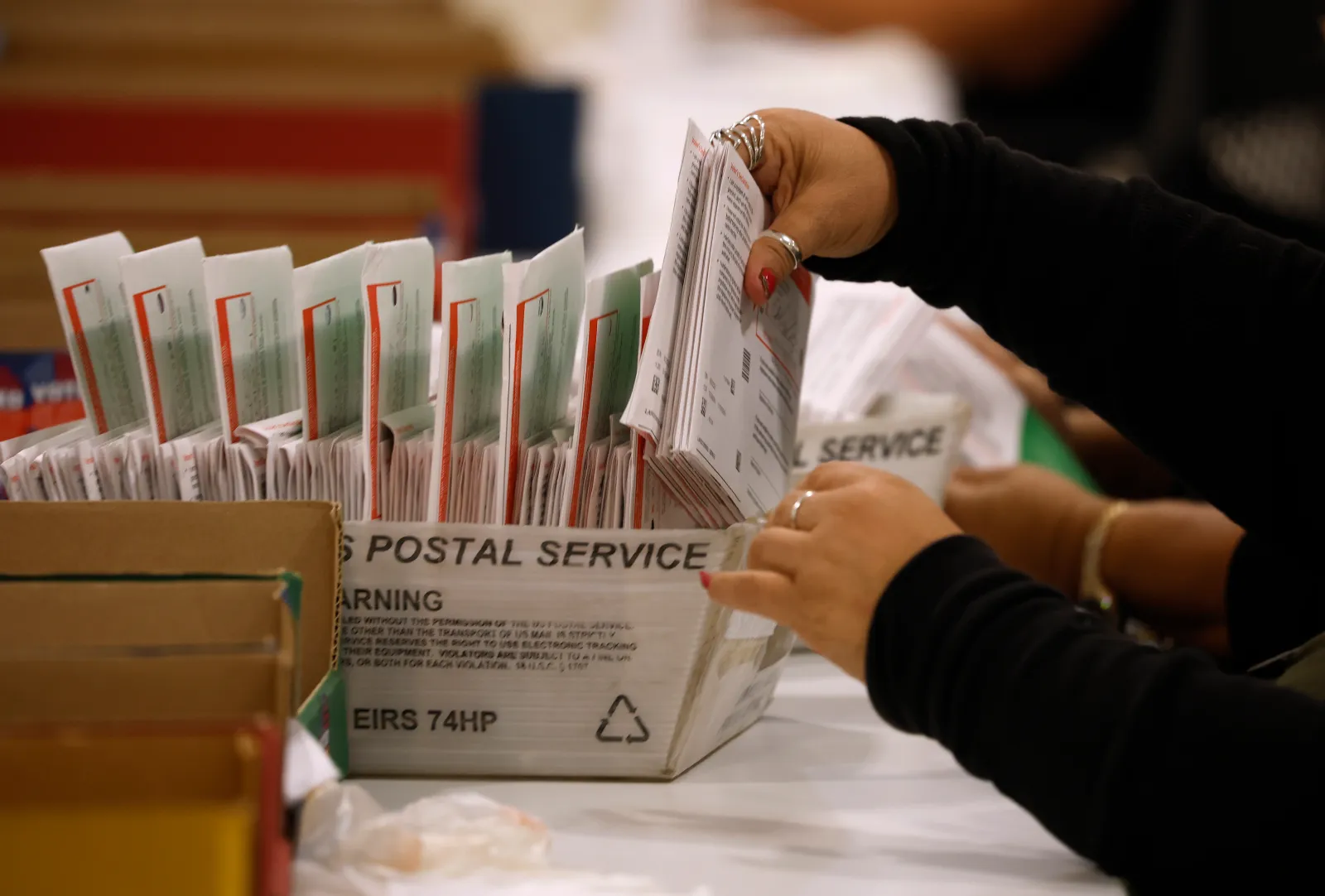 An election worker processes mail-in ballots for the California primary election at the Los Angeles County Ballot Processing Center on June 5, 2026, in City of Industry, California. The Department of Justice sent a federal prosecutor to observe ballot counting in Los Angeles County after President Donald Trump alleged, without evidence, that delays in counting ballots were the result of election fraud. (Photo by Justin Sullivan/Getty Images)
