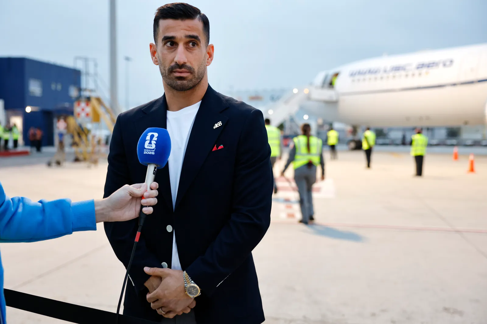 Iranian national soccer team captain Ehsan Hajisafi speaks to the press after arrival at Tijuana International Airport on June 7, 2026, in Tijuana, Mexico. (Photo by Mario Tama/Getty Images)