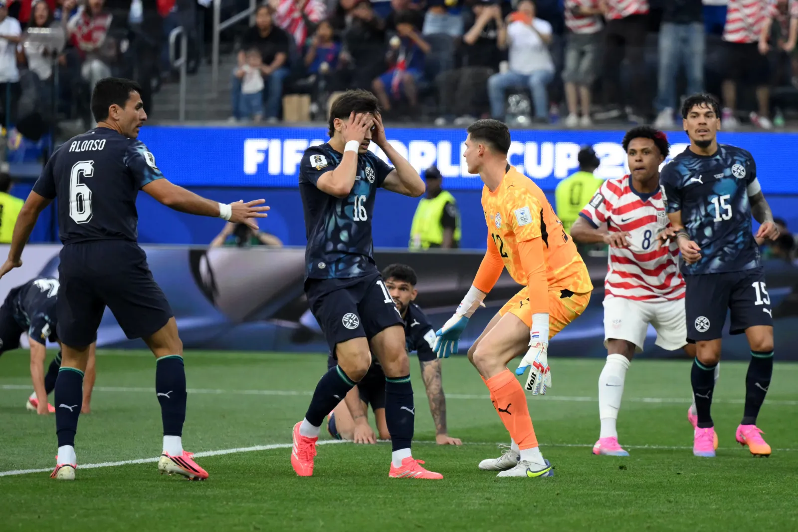 Paraguay's midfielder #16 Damian Bobadilla (C) reacts after scoring an own goal the 2026 World Cup Group D football match between USA and Paraguay at the Los Angeles Stadium in Inglewood on June 12, 2026. (Photo by Patrick T. Fallon / AFP via Getty Images)