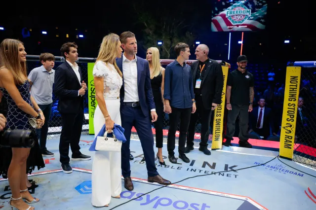Eric Trump, Lara Trump and other guests gather inside the Octagon at UFC Freedom 250 on the South Lawn of the White House in Washington, DC, on June 15, 2026.