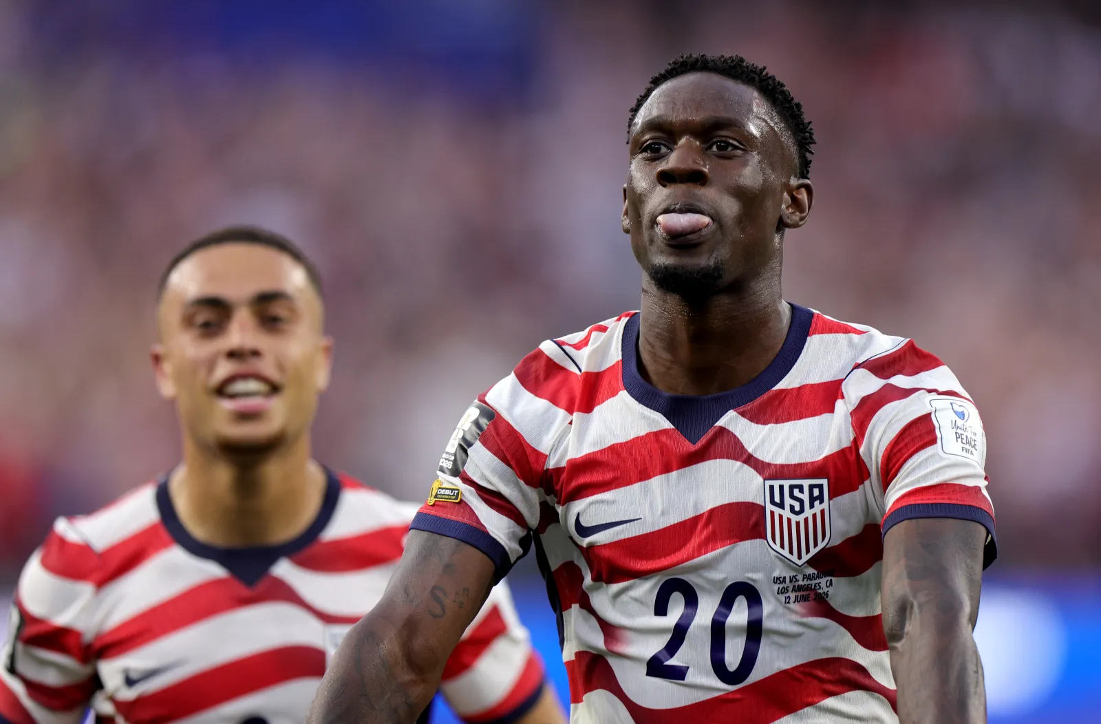 LOS ANGELES, CALIFORNIA - JUNE 12: Folarin Balogun #20 of the United States celebrates scoring his team's third goal during the FIFA World Cup 2026 Group D match between USA and Paraguay at Los Angeles Stadium on June 12, 2026 in Los Angeles, California. (Photo by John Dorton/USSF/Getty Images)
