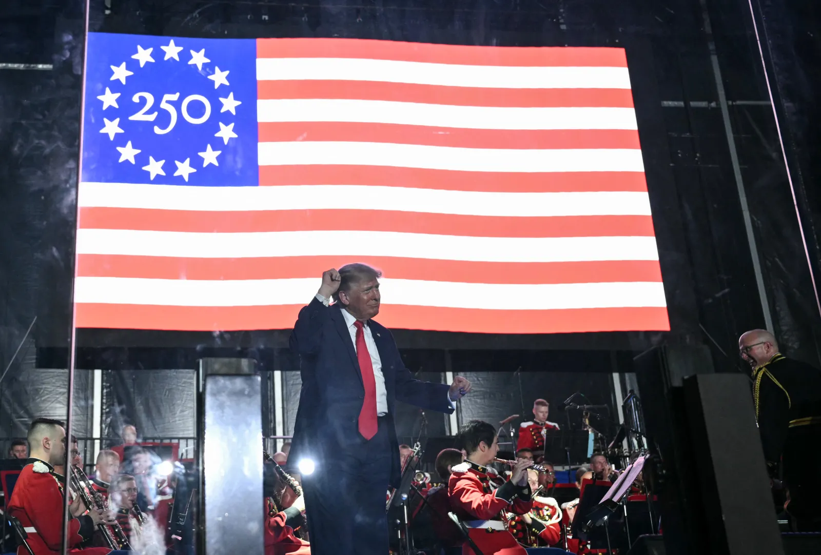 US President Donald Trump dances after speaking during the kick-off celebration for the "Great American State Fair" on the National Mall in Washington, DC, June 24, 2026. The "Great American State Fair" will be held from June 25 to July 10, 2026, to celebrate the 250th anniversary of US independence. (Photo by Mandel NGAN / AFP via Getty Images)