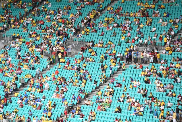 Football fans sit in the stands before a Group F football match between Bosnia-Herzegovina and Iran at the Fonte Nova Arena in Salvador during the 2014 FIFA World Cup in Brazil on June 25, 2014.