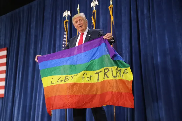 Donald Trump holds a rainbow