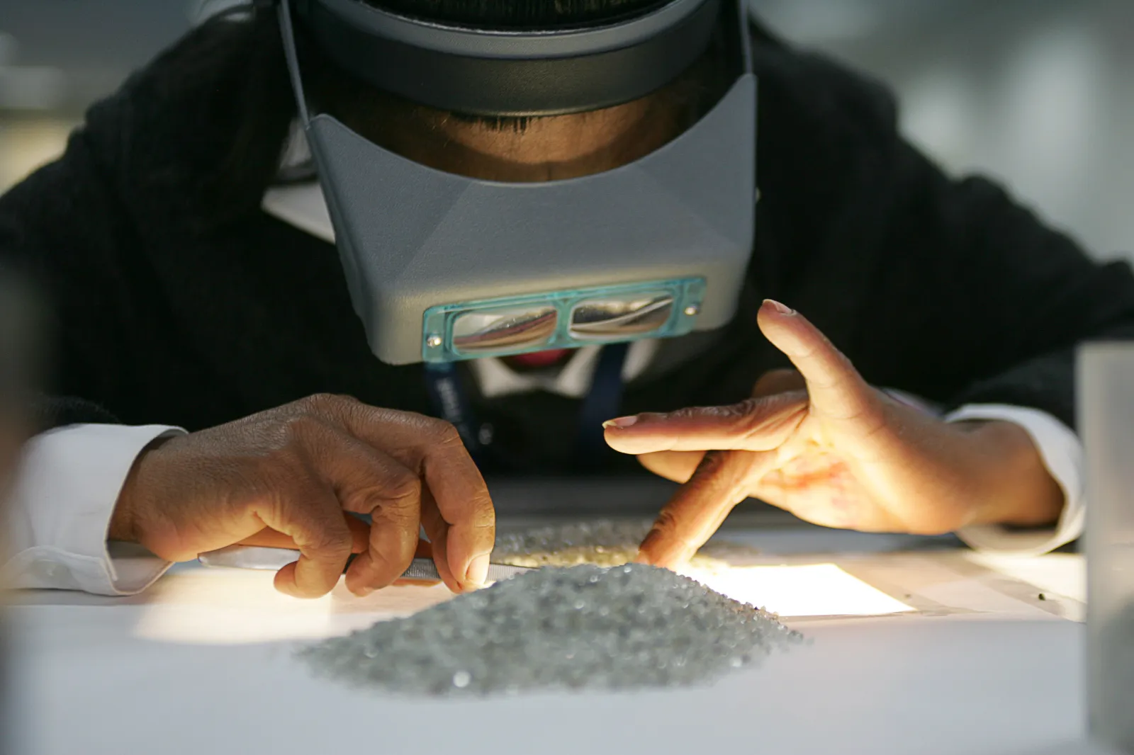 A staff sorts diamonds at the new Diamond Trading Company Botswana on the eve of its opening ceremony on March 17, 2008, in Gaborone.
