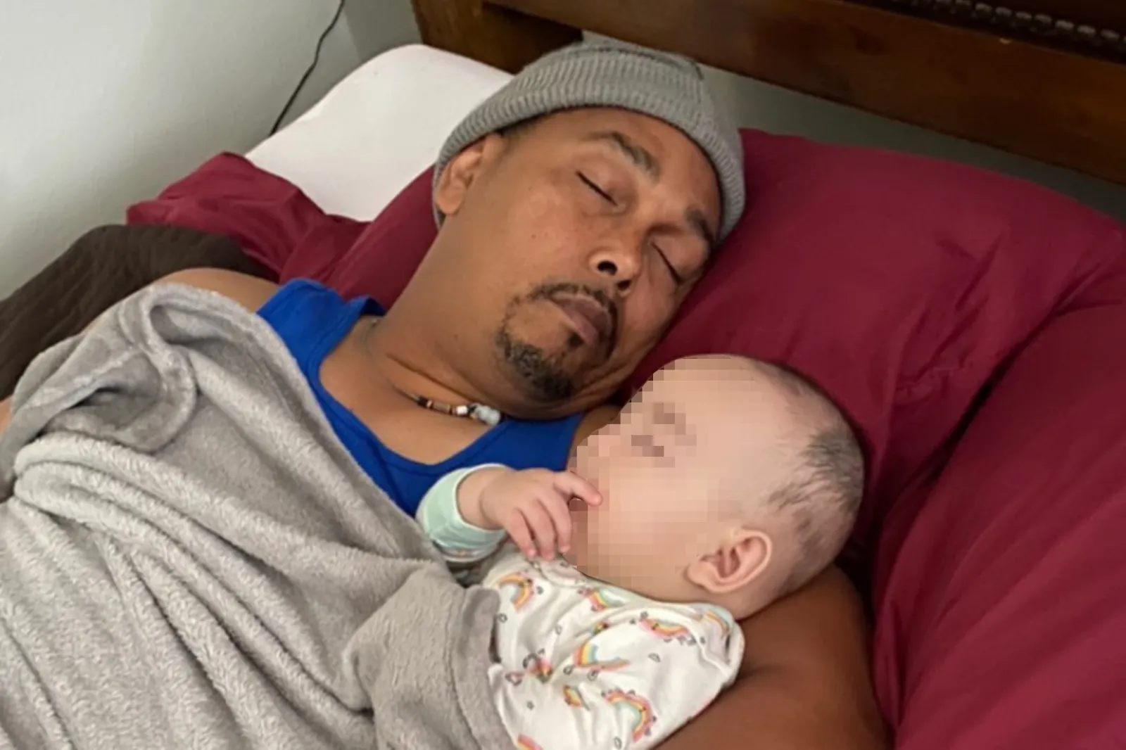 Sherry Santana De Leon's husband Benjamin Santana pictured asleep with baby Emily.