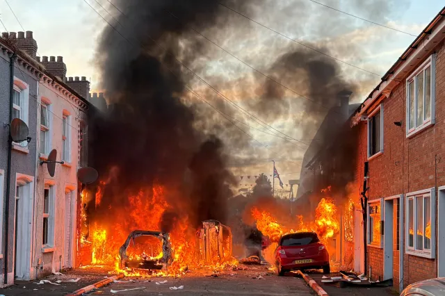 Vehicles set on fire by protesters burn in east Belfast on Tuesday, June 9, 2026.