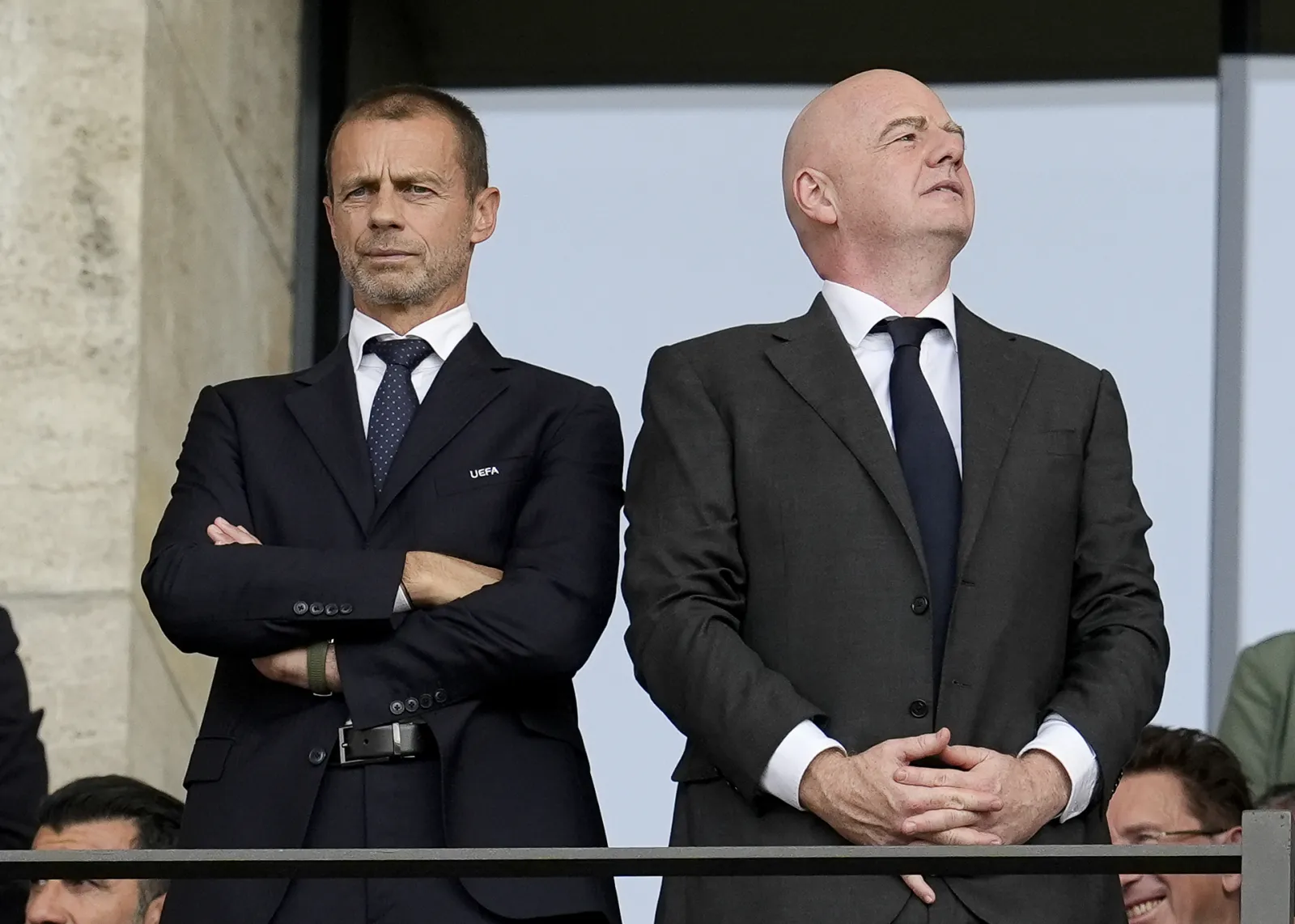 UEFA president Aleksander Ceferin (left) with FIFA president Gianni Infantino. Ceferin says taking matches away from their community roots risks "breaking" football. (Press Association via AP Images)