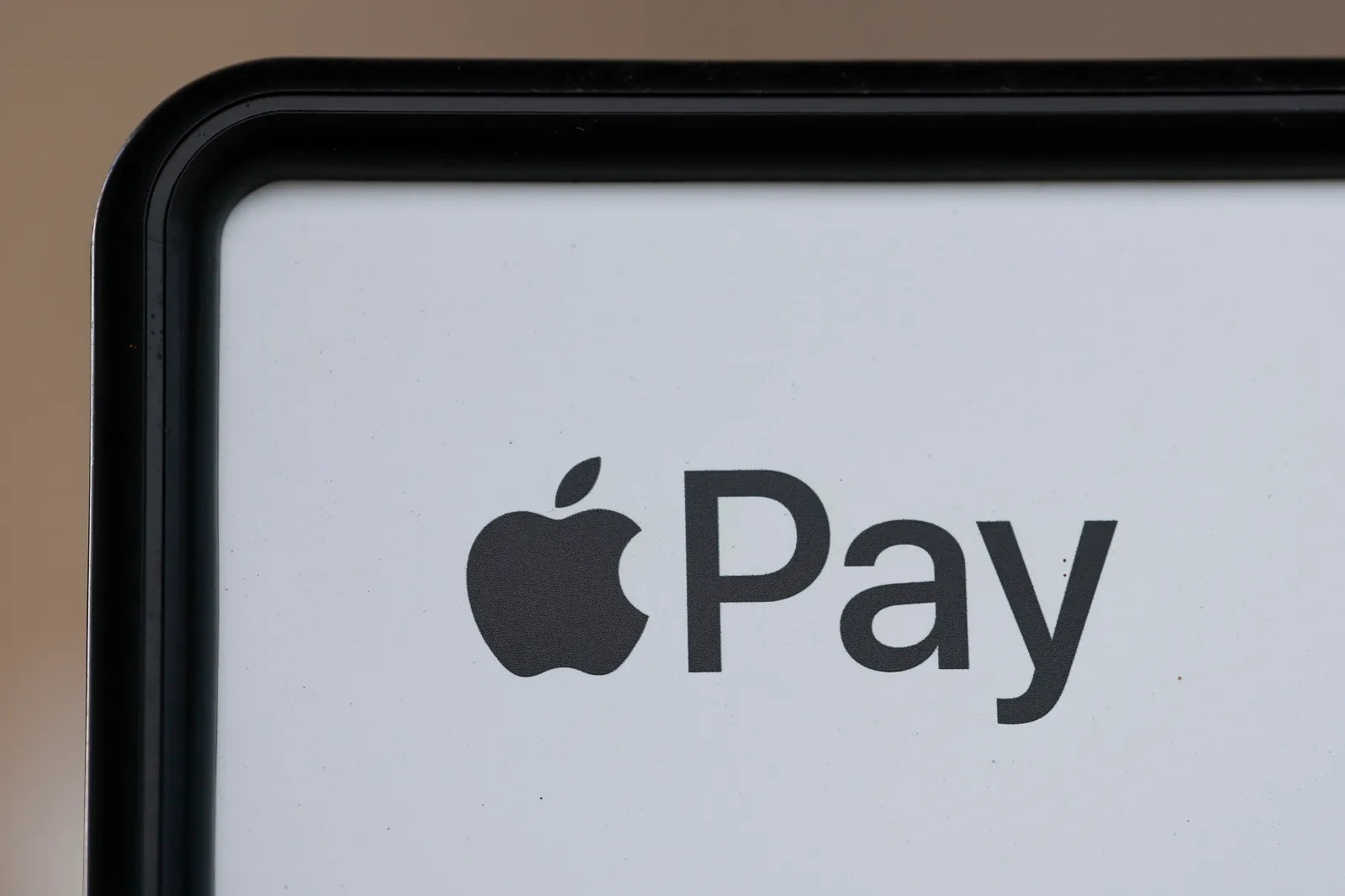 The Apple Pay logo is pictured at a gas station on May 10 in Houston. (Aaron M. Sprecher via AP)