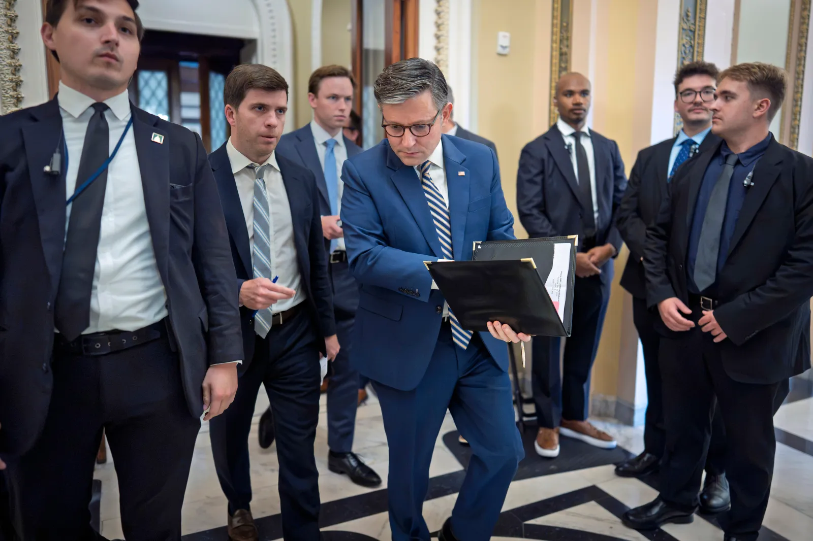 Speaker of the House Mike Johnson, leaves the chamber as members debate a series of measures including a continuing resolution to fund the government and a spending package for the Iran war, at the Capitol in Washington, D.C., on July 21, 2026.