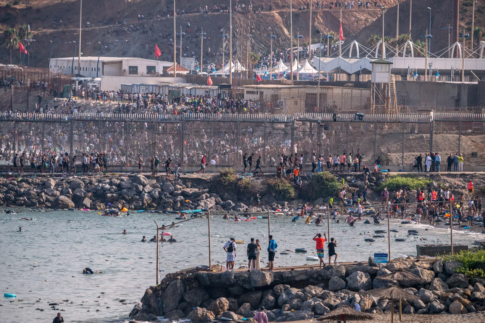 In Pictures: How Wave of Migrants Is Crossing Into Ceuta by Sea - Newsweek