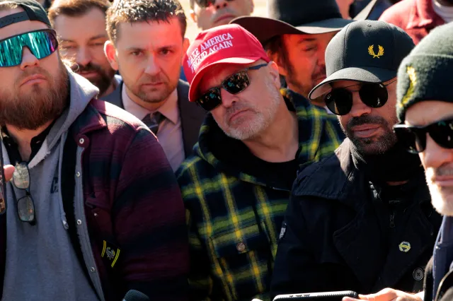Members of the far-right group the Proud Boys, including (L-R) Ethan Nordean, Zach Rehl, Joe Biggs, former leader Enrique Tarrio and Dominic Pezzola, speak to journalists on the east side of the U.S. Capitol on February 21, 2025 in Washington, DC.
