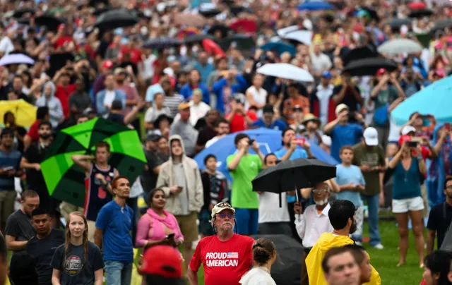 People gather on the National Mall during the "Salute to America" Fourth of July event with U.S. President Donald Trump at the Lincoln Memorial in Washington, DC, July 4, 2019.