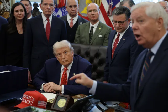 U.S. President Donald Trump listens as U.S. Sen. Lindsey Graham (R-SC) speaks during a bill signing in the Oval Office of the White House on February 03, 2026 in Washington, DC. (Photo by Alex Wong/Getty Images)