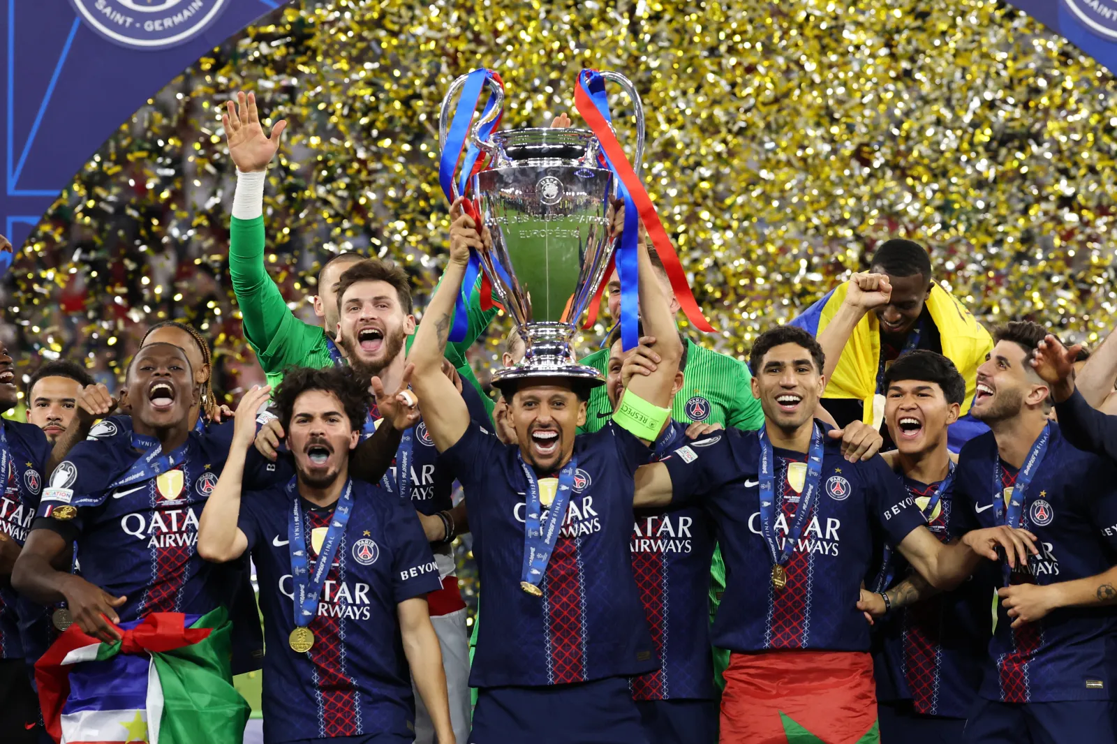 Marquinhos of Paris Saint-Germain lifts the UEFA Champions League trophy after his team's victory in the UEFA Champions League Final 2026 match between Paris Saint-Germain and Arsenal FC at Puskas Arena on May 30, 2026 in Budapest, Hungary. (Photo by Carl Recine/Getty Images)