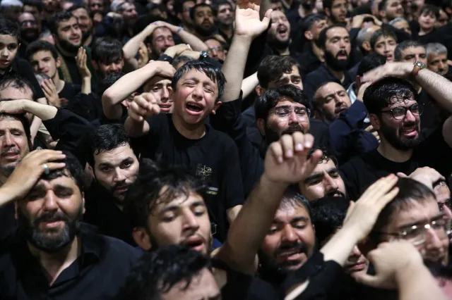 This handout photograph provided by the Iranian supreme leader office (Khamenei.IR) shows mourners gathering around the coffin of Iran's slain supreme leader Ali Khamenei during a ceremony ahead of his funeral in Tehran on July 3, 2026.