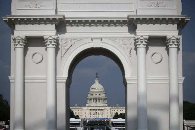A replica of President Trump’s planned “triumphal arch” and the U.S. Capitol are seen during the "Great American State Fair" on the National Mall on July 1, 2026 in Washington, DC.