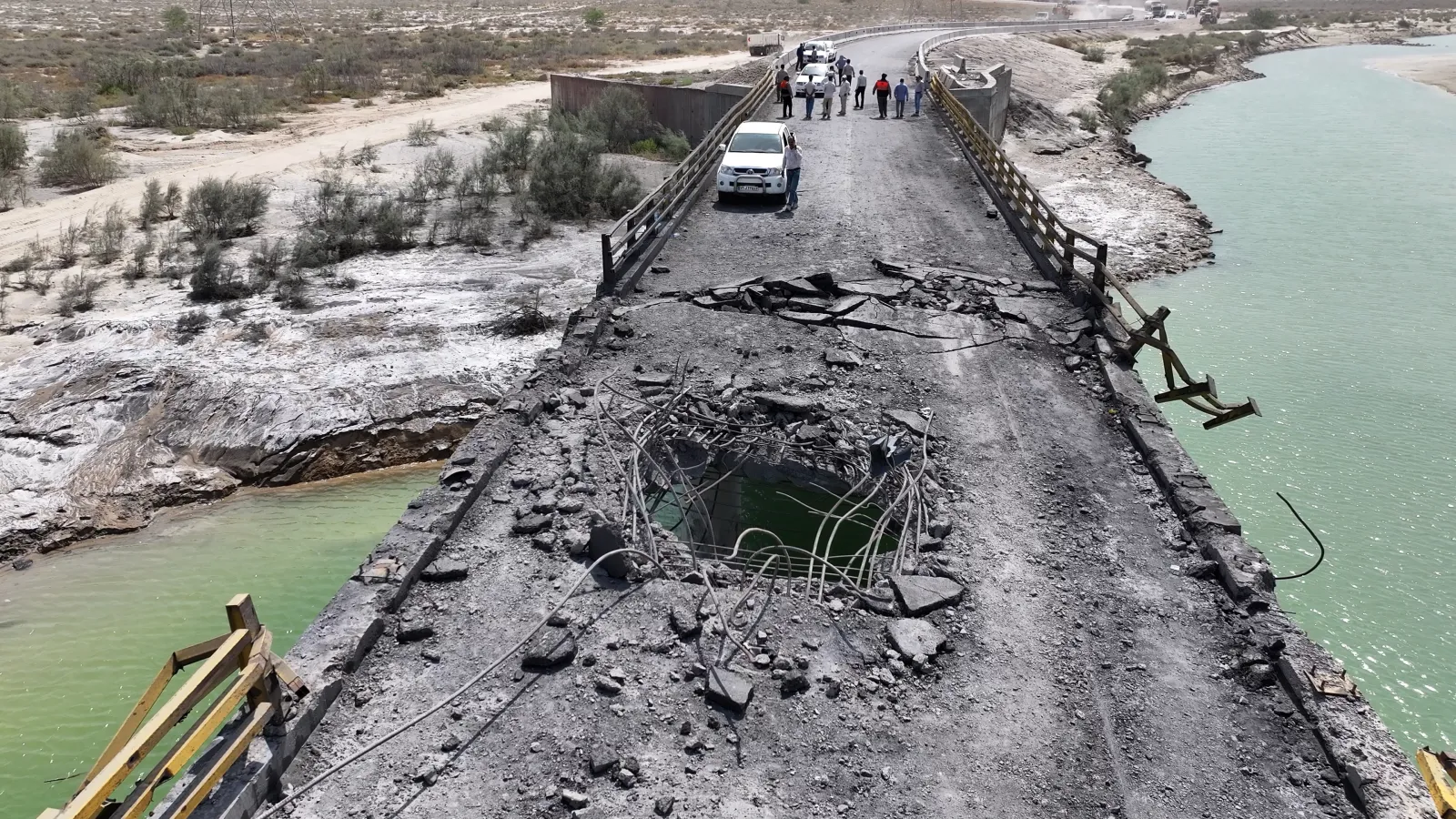 A hole is visible in a damaged bridge, following U.S. airstrikes carried out a day earlier, on July 17, 2026, in the southern Hormozgan Province, Iran. The strikes targeted bridges linking Hormozgan province with neighboring cities, disrupting key transportation routes, according to Iranian authorities. US Central Command did not confirm a list of its targets but said the recent attacks were intended to "further degrade Iranian military capabilities."
