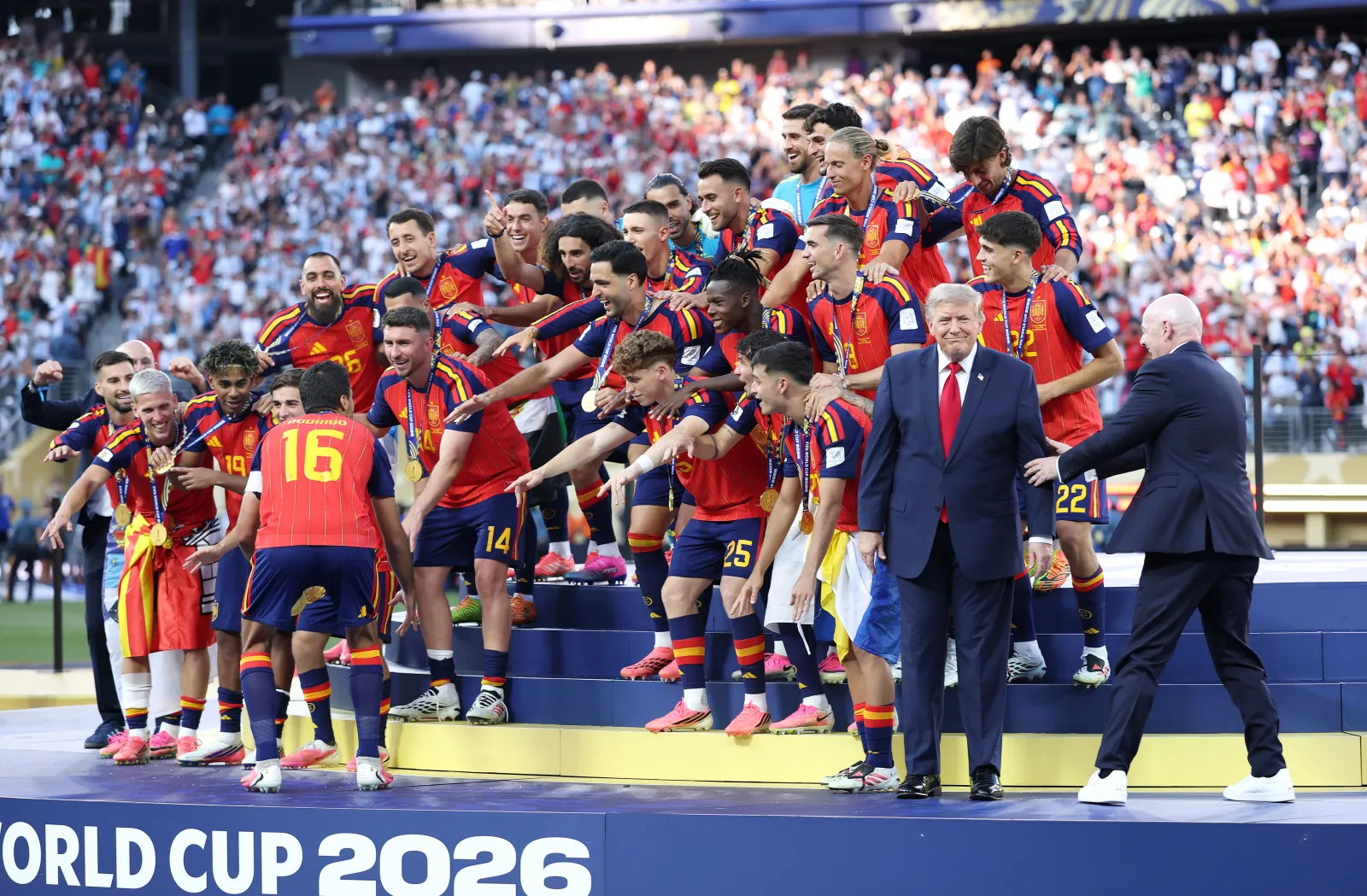 Rodri #16 of Spain prepares to lift the FIFA World Cup Winner’s Trophy as FIFA President Gianni Infantino directs U.S. President Donald Trump after the team’s victory following during the FIFA World Cup 2026 Final match between Spain and Argentina at New York New Jersey Stadium on July 19, 2026 in East Rutherford, New Jersey. (Photo by Dan Mullan/Getty Images)