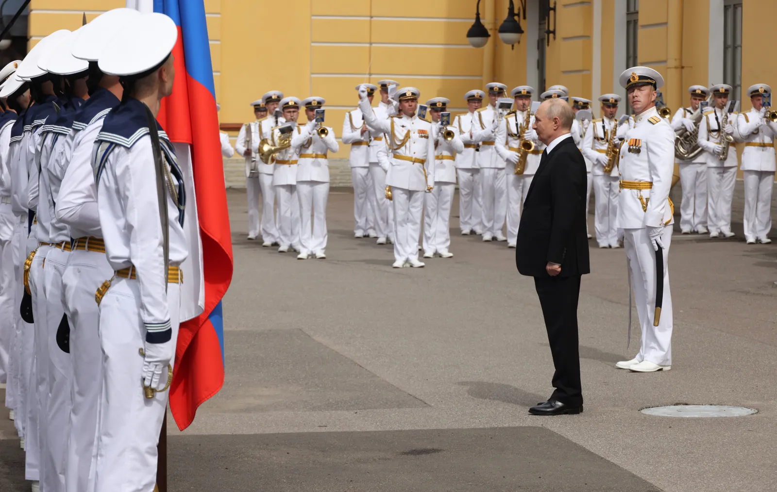 Russian President Vladimir Putin greets officers in St. Petersburg, Russia, on July 26, 2026.