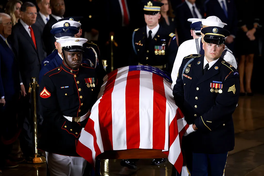 WASHINGTON, DC - JULY 28: An Armed Forces Body Bearer Team carries the casket of late Republican Senator Lindsey Graham during a memorial tribute to the late U.S. Sen. Lindsey Graham (R-SC) in the Rotunda of the U.S. Capitol on July 28, 2026 in Washington, DC. Graham, who was elected to the Senate in 2002, died suddenly on July 11th from an aortic dissection. He was 71 years old. (Photo by Tierney L. Cross - Pool)