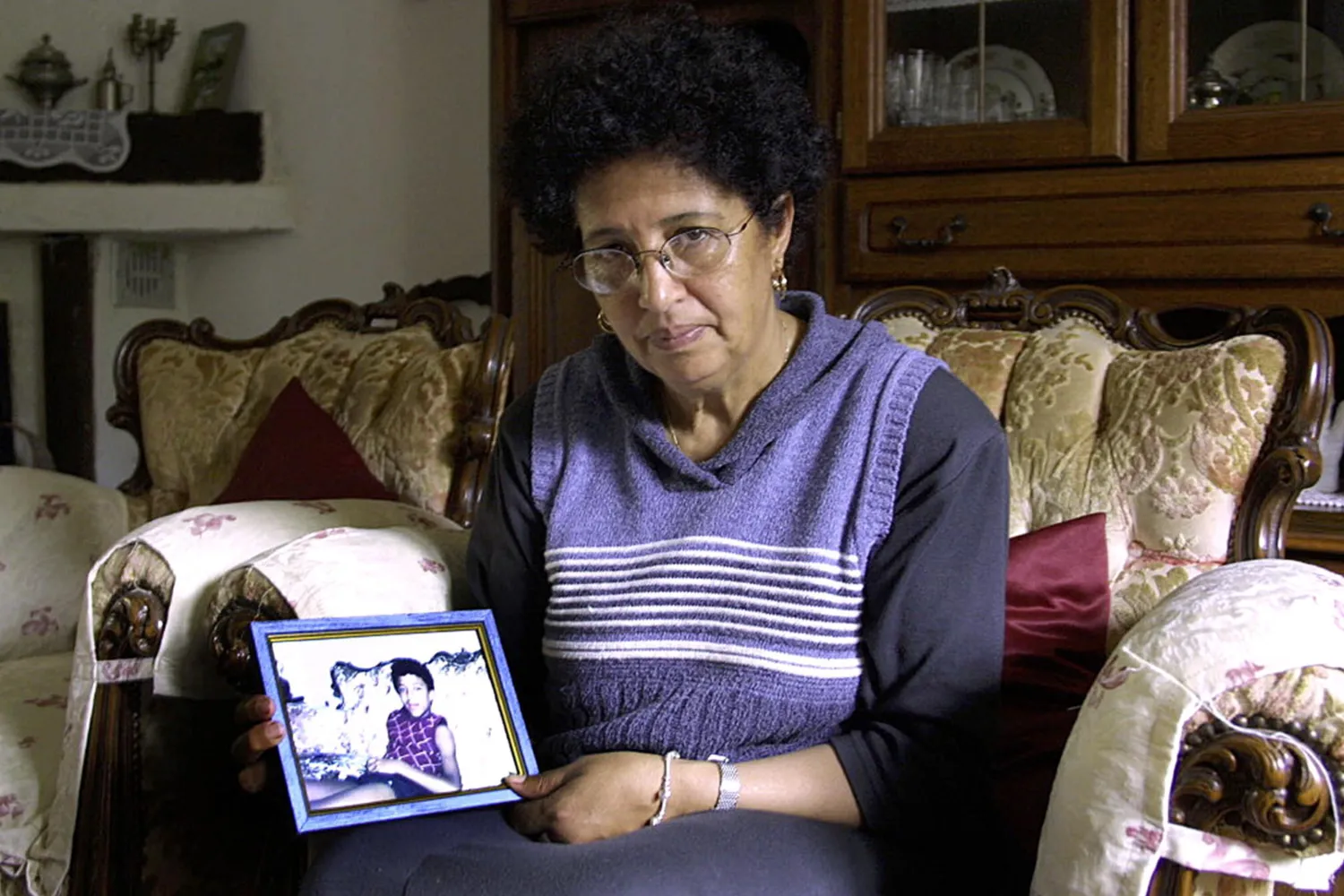 SPECIAL USA TODAY Aïcha El Waffi, mother of suspected September 11 terrorist Frenchman Zacarias Moussaoui, shows a photo of her son 01 June 2002 in her Narbonne residence.