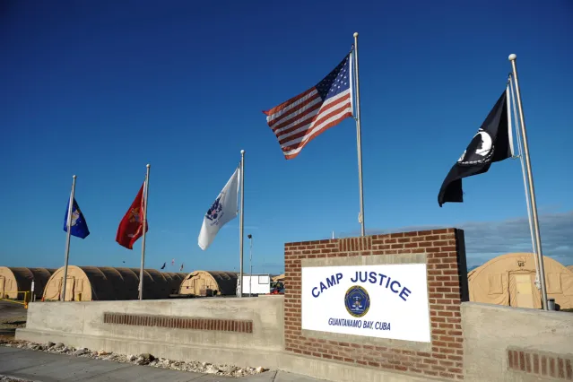 An image reviewed by the US military shows a "Camp Justice" sign near the high-tech, high-security courtroom which will hold the pre-trial sessions for Khalid Sheikh Mohammed and his four co-defendants on charges related to the 9/11 attacks at "Camp Justice" on December 07, 2008 in Guantanamo Bay, Cuba. Khalid Sheikh Mohammed, the alleged mastermind of the September 11, 2001 attacks, is set to appear Monday before a US military tribunal where he will face victims' kin for the first time.