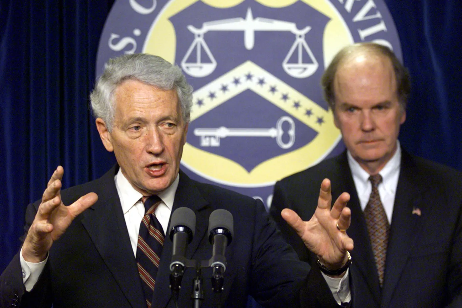 Deputy Treasury Secretary Kenneth Dam (L) and US Customs Commissioner Robert C. Bonner (R) announce the launch of Operation Green Quest 25 October 2001 in Washington, DC. The initiative will target current and future terrorist funding sources.