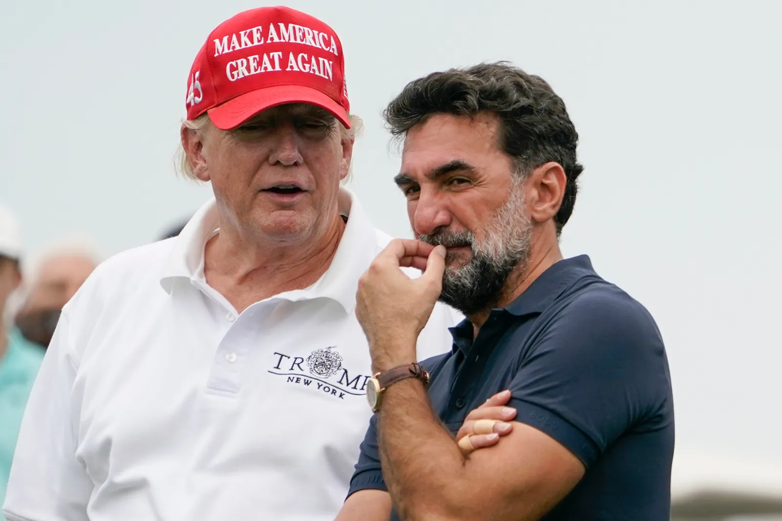 Donald Trump talks with Yasir Al-Rumayyan, governor of Saudi Arabia's Public Investment Fund, at the Bedminster Invitational LIV Golf tournament in Bedminster, New Jersey, July 29, 2022.